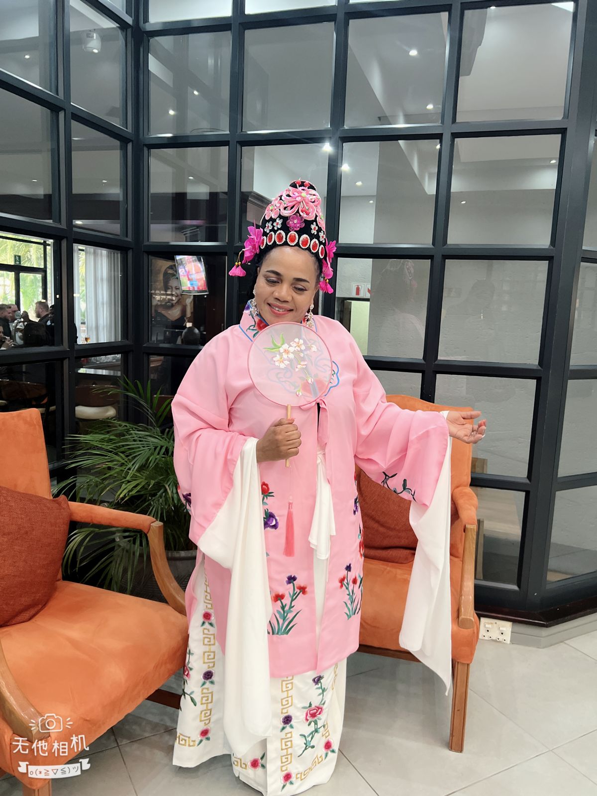 Gibby Memane wearing traditional Chinese dress at a cultural exchange event