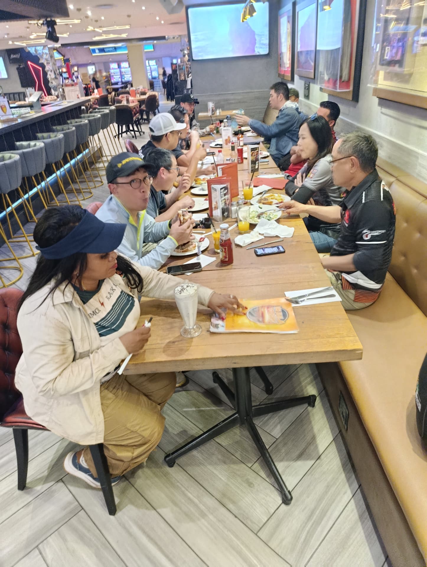 Guests sharing a long table dinner after a day on tour