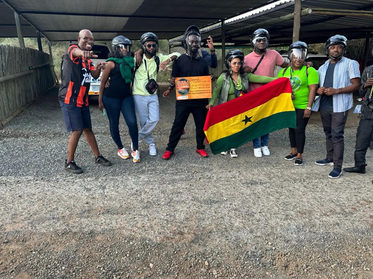 Quad bike group with the Ghanaian flag before setting off