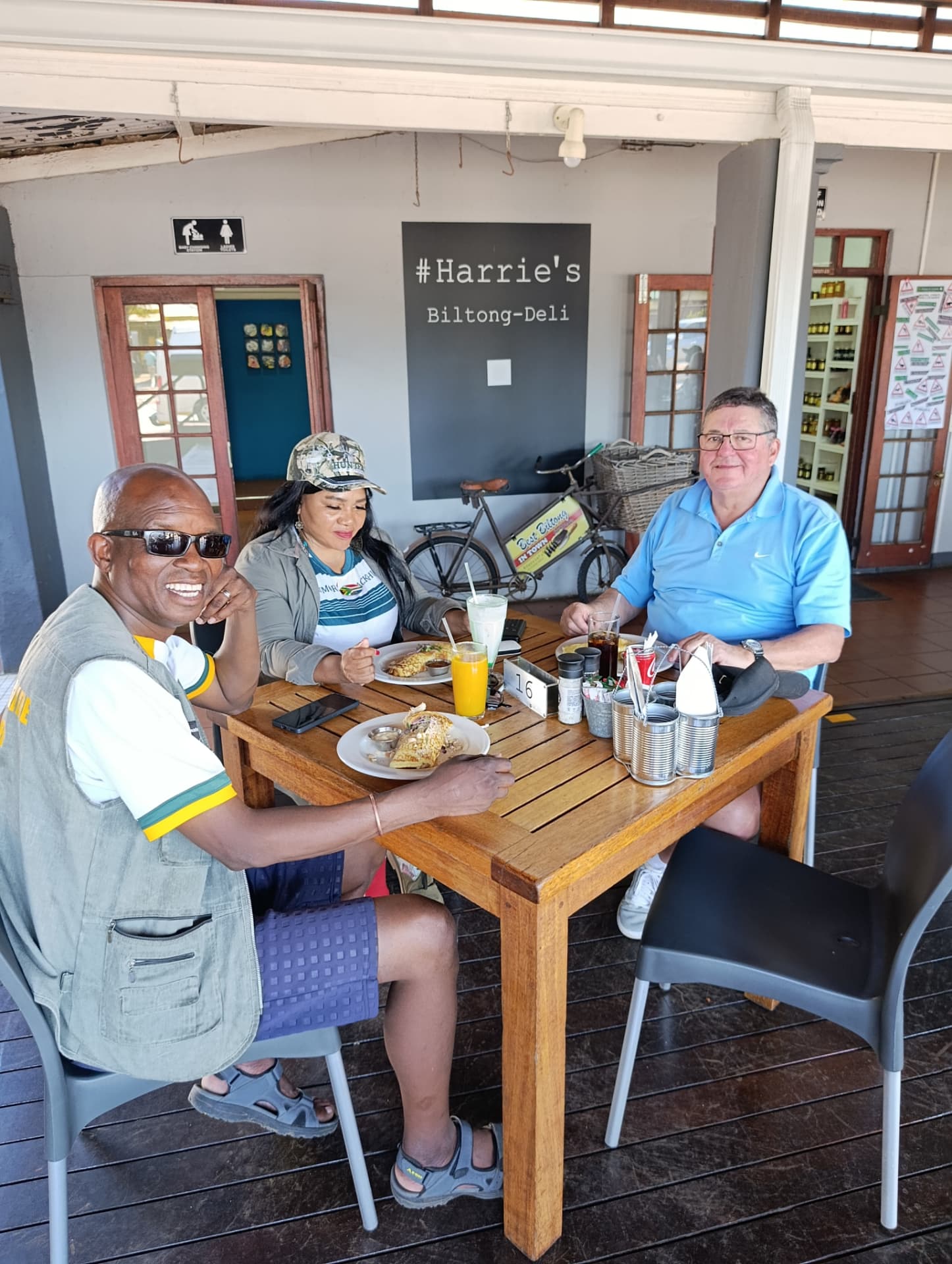 Guests enjoying lunch on the stoep at a country biltong deli