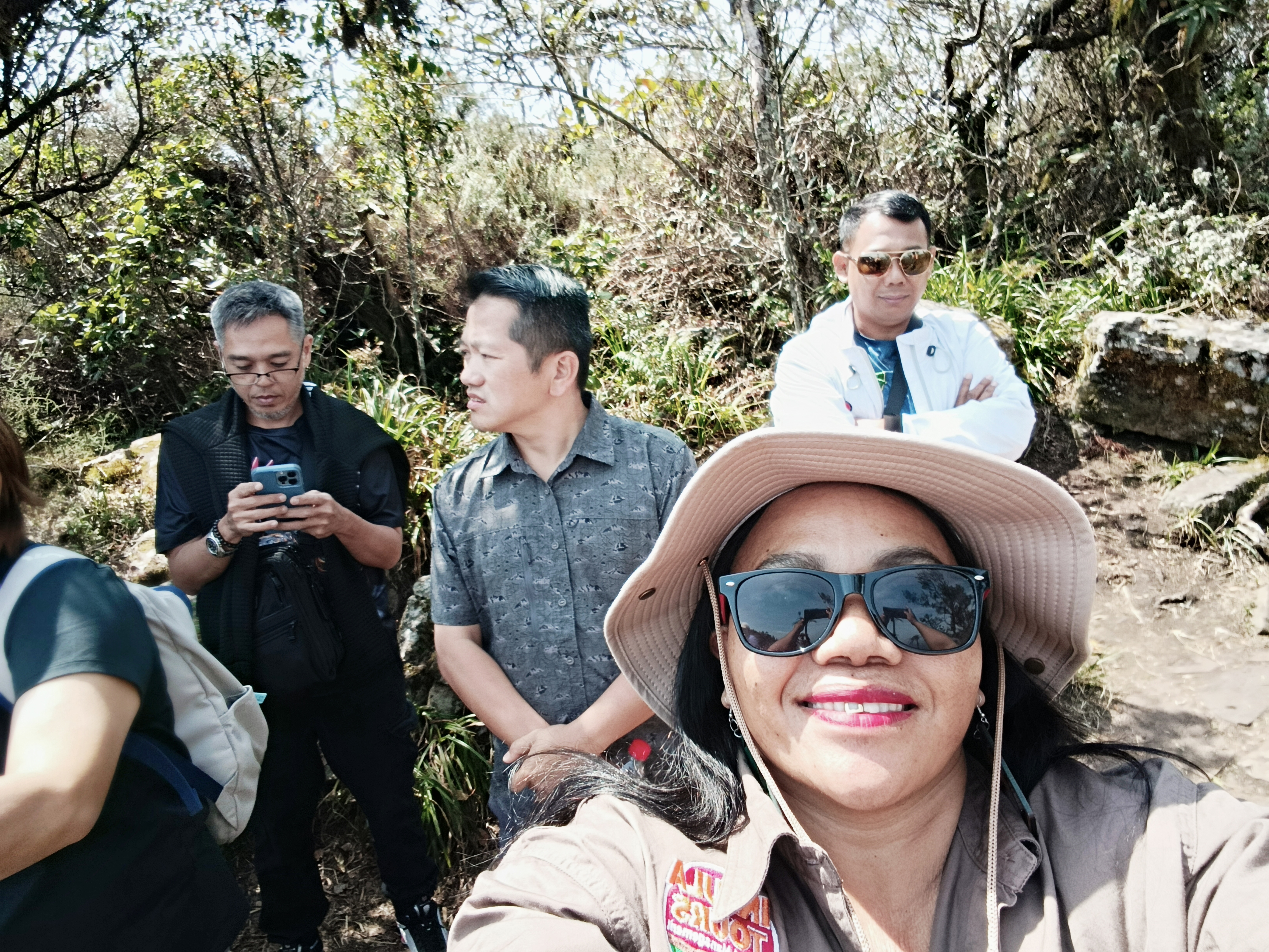 Guests pausing on a canyon trail walk with their guide